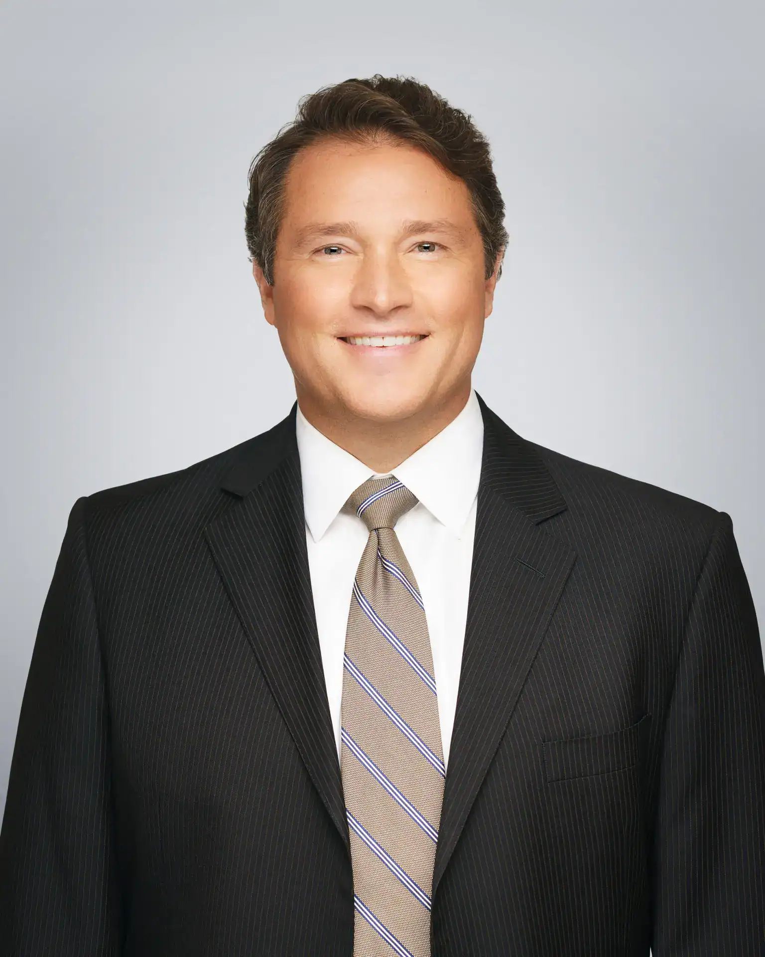 Attorney Doll Amir Eley smiling in a professional portrait.