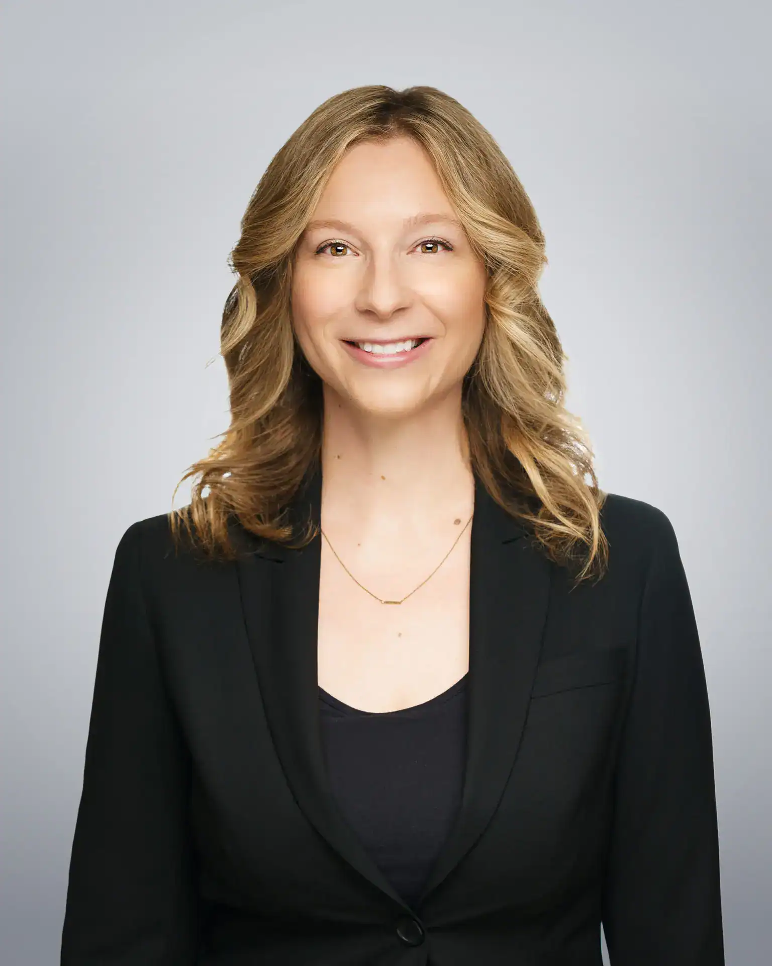 Attorney Doll Amir Eley smiling in professional portrait.