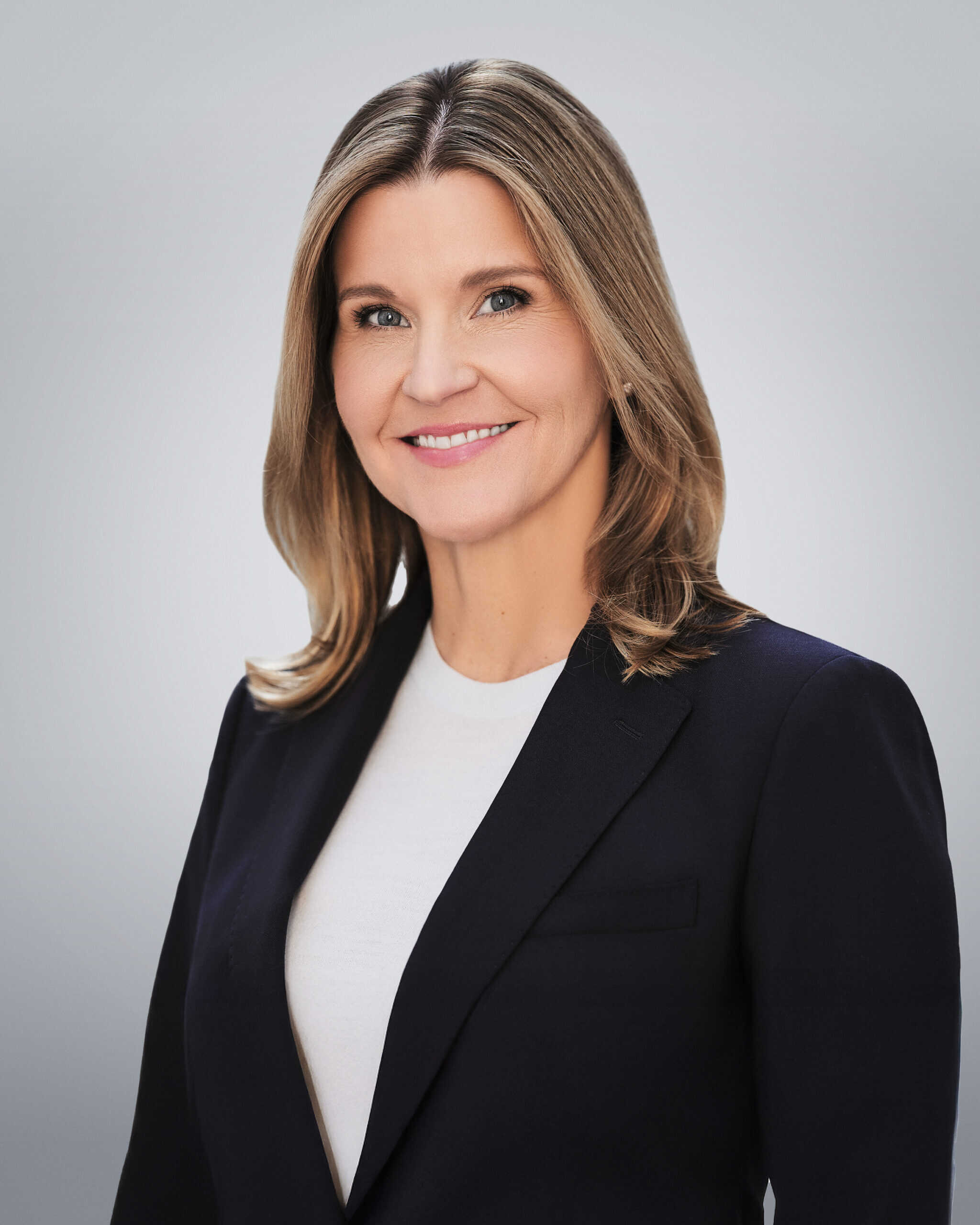 Attorney Doll Amir Eley smiling in professional portrait.